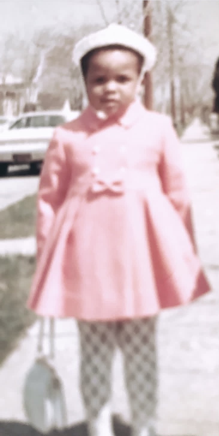 Vintage Easter Sunday portrait of Donnamarie Dukes in a pink coat and hat.